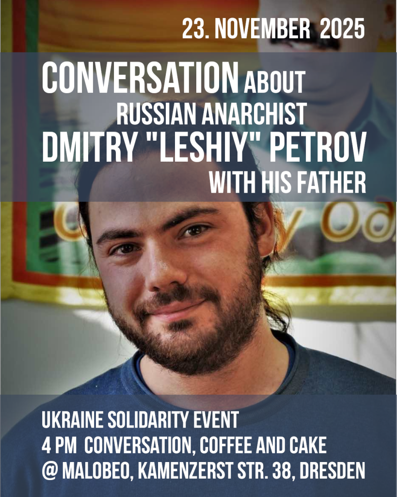 Dimitri Petrow in front of a picture of Ocalan Text Conversation about russian anarchist Dmitry "Leshiy" Petrov with his father
